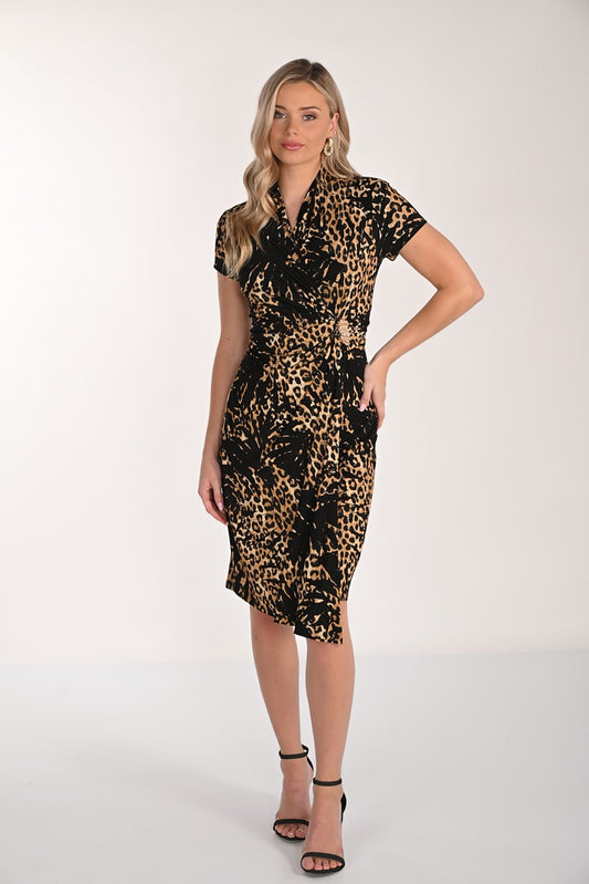 Woman wearing a leopard print dress on a white background